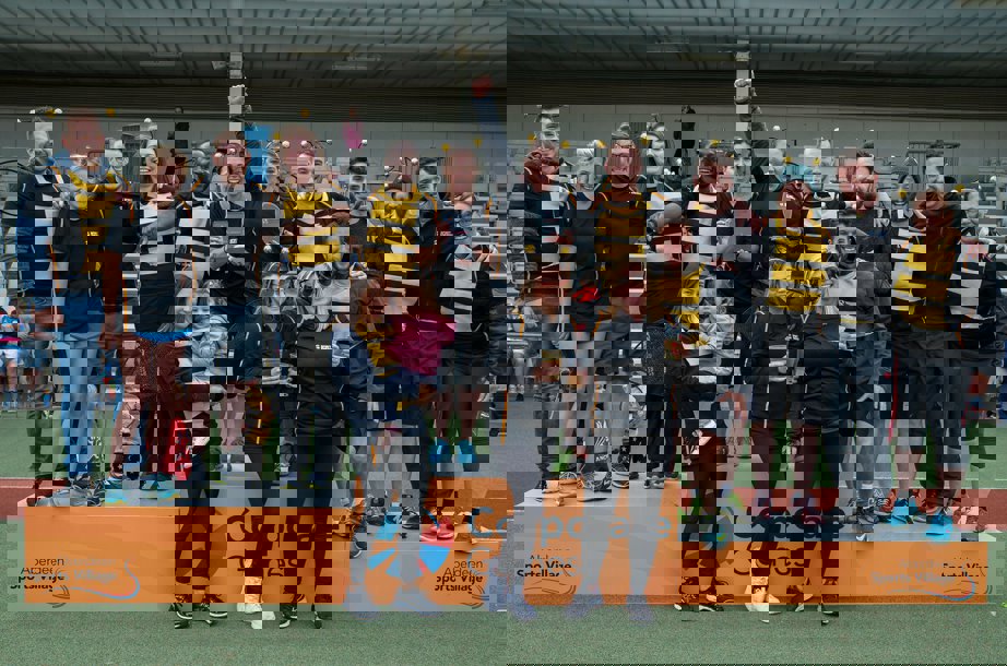 A group of people dressed up in costumes standing on a podium.