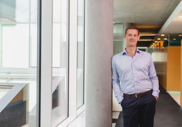 Spirit Energy's Arnaud Mille leaning against a pillar and smiling for the camera